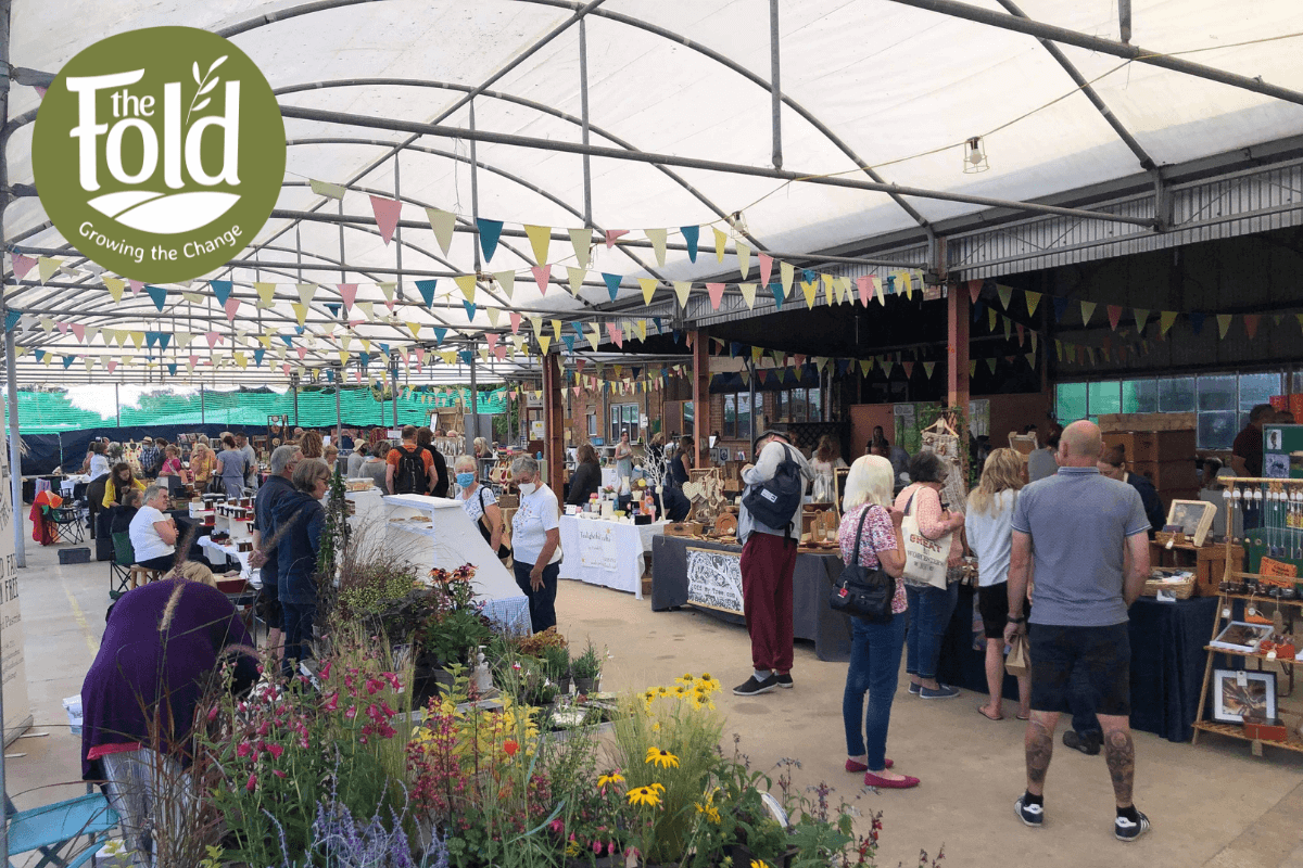 Shoppers and market stalls at The Fold