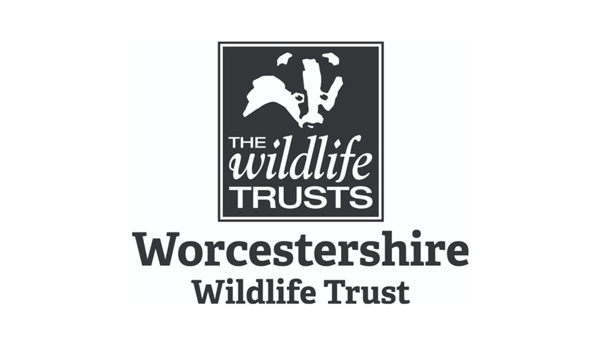 WWT Logo - a badger face in black and white