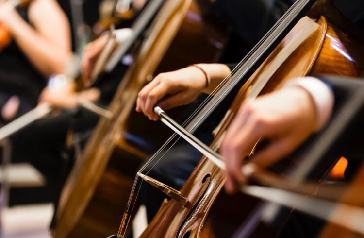 Musicians playing cellos