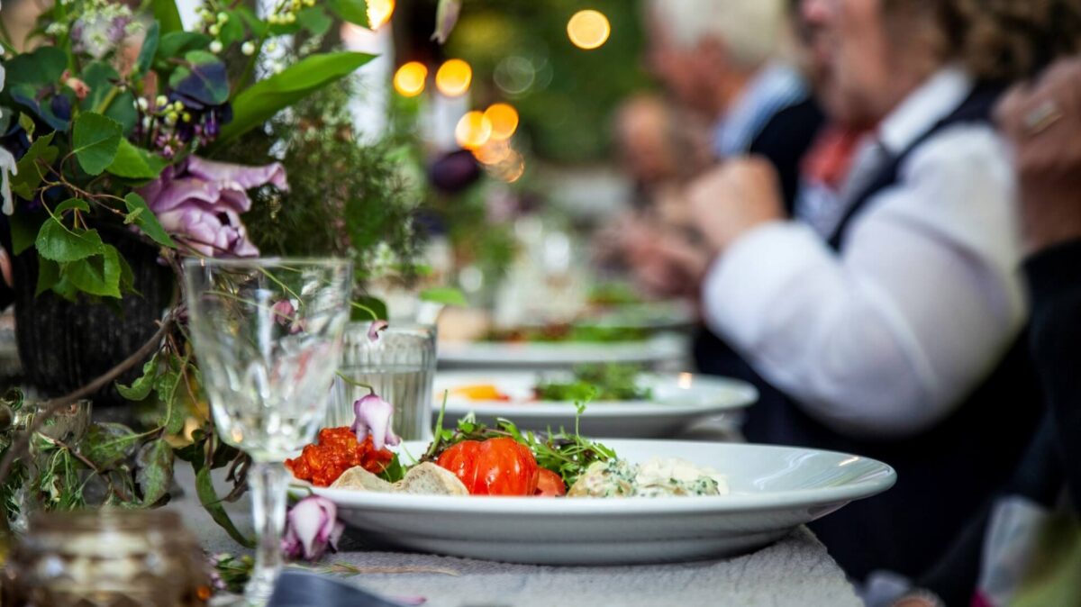 Customers enjoying food at the table