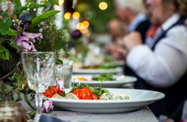 Customers enjoying food at the table