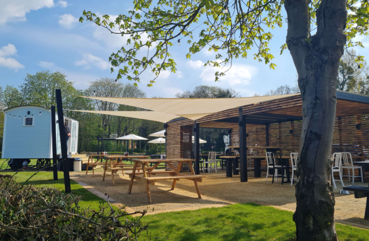 Covered out door seating on a sunny day at the Rose and Crown