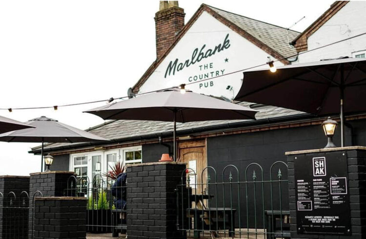 Exterior of the pub and outdoor seating