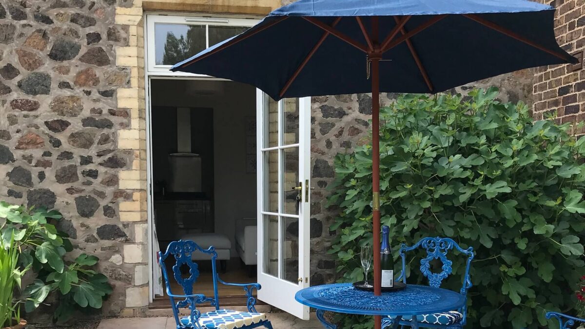 Table and chairs outside flat