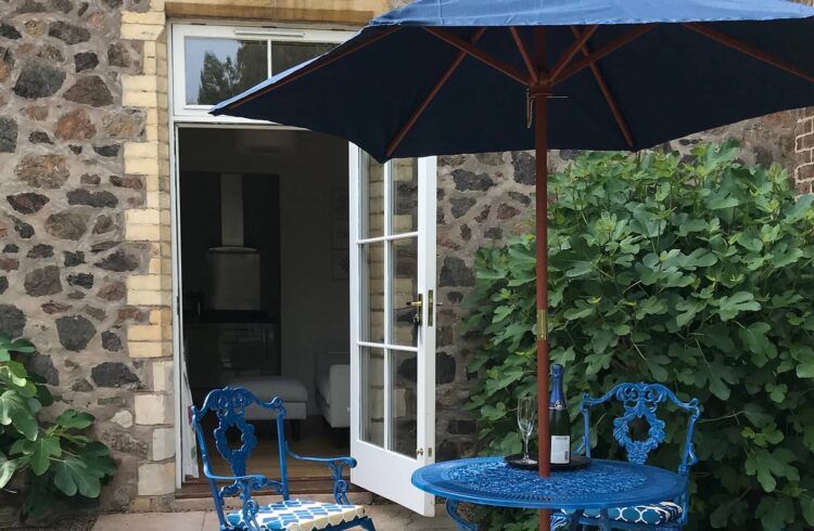 Table and chairs outside flat