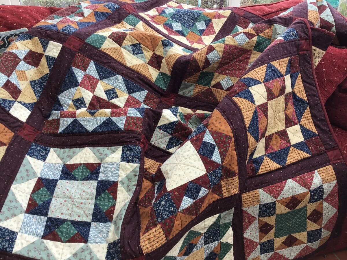 Multi-coloured quilt with geometric shapes