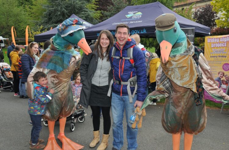 People and street entertainers at Malvern Well Dressing & Water Festival Family Fun Day