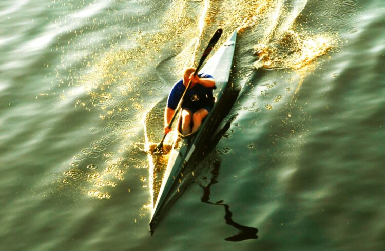 Man canoeing down the river