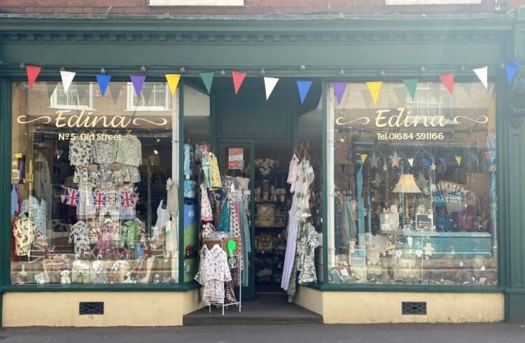 A dark green and yellow painted shop front