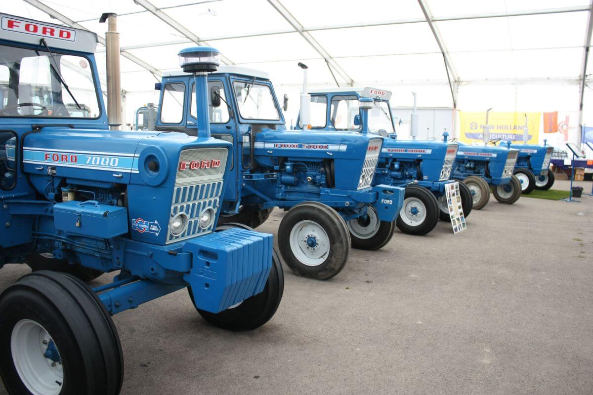 A row of blue tractors