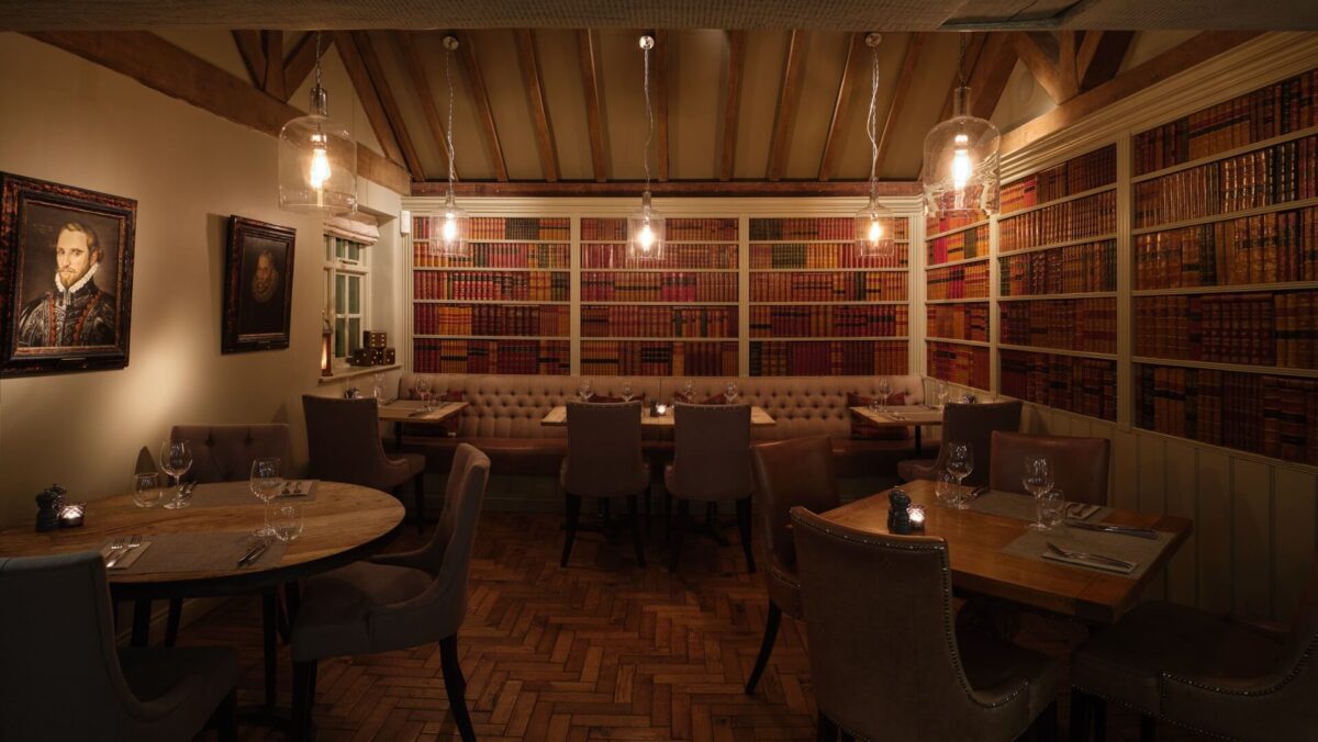 Dining area with paintings on the walls