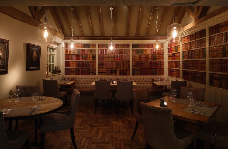 Dining area with paintings on the walls