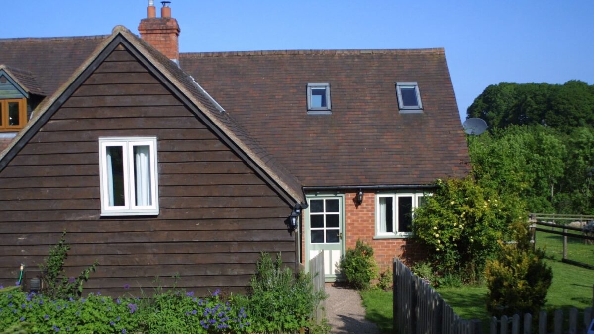 Daisy Cottage exterior view with grass and plants to front of property