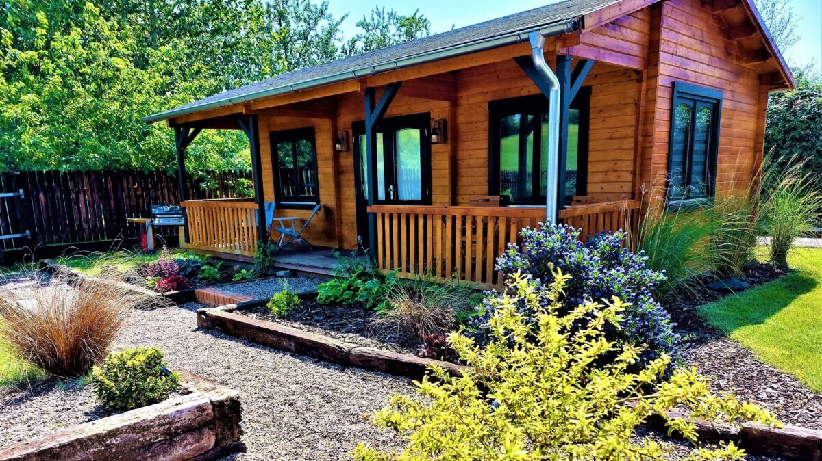 Courtyard Cabin exterior with plants to front