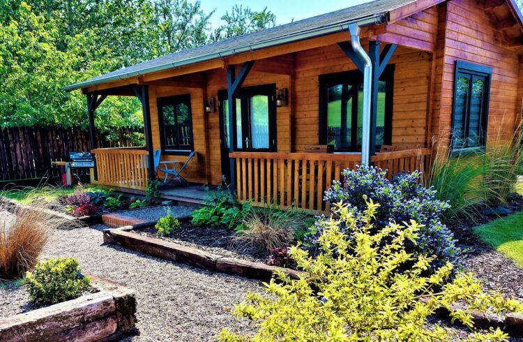 Courtyard Cabin exterior with plants to front