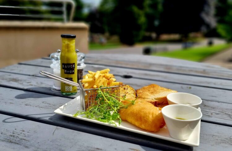 Fish and chips served on an outside table