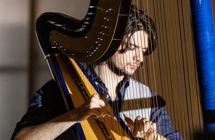 Ben Creighton-Griffiths playing the harp