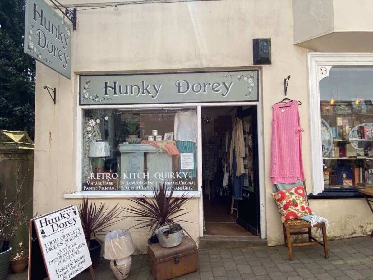 Small shop front with homewares and clothing outside