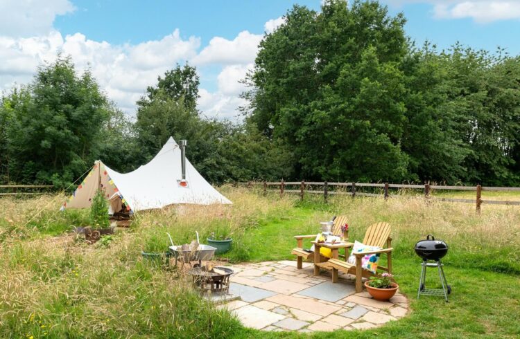 Exterior of bell tent and outdoor seating area