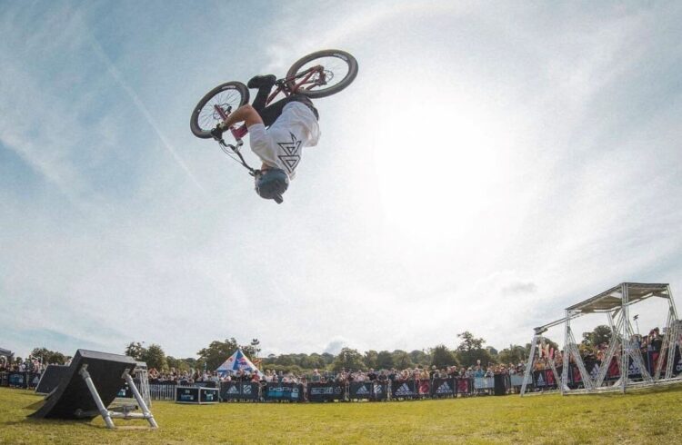 A person doing a flip on a BMX