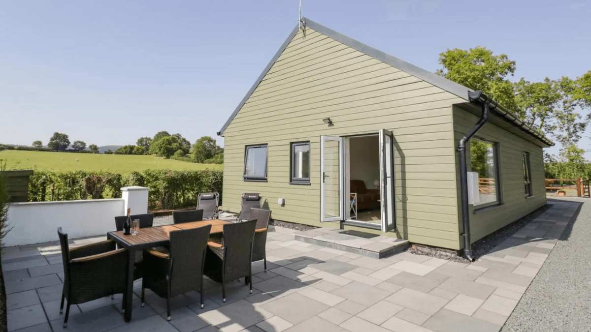 Outside seating area on patio with views over countryside