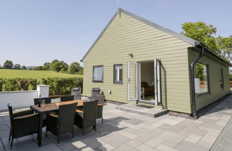 Outside seating area on patio with views over countryside