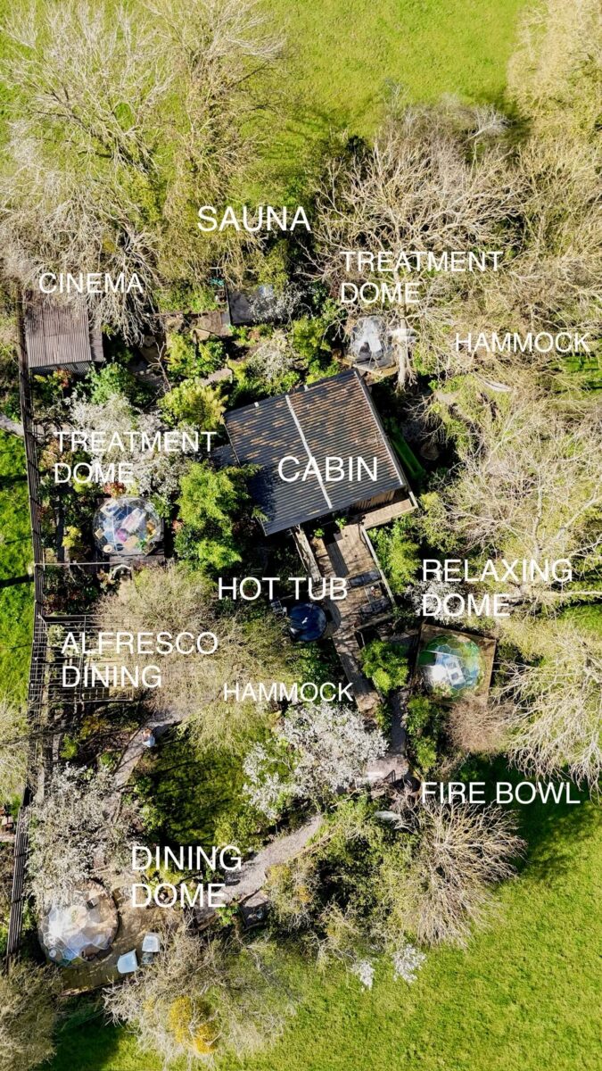 An aerial view of a cabin in the woods