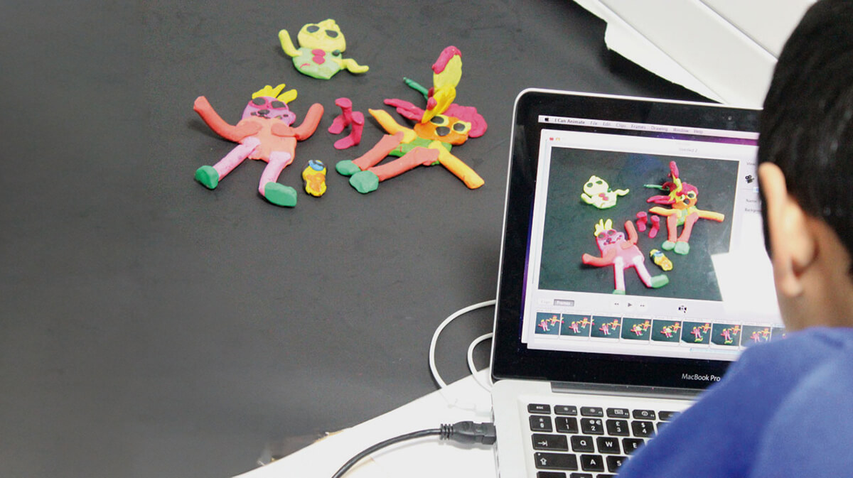 A child using a computer to produce an animation