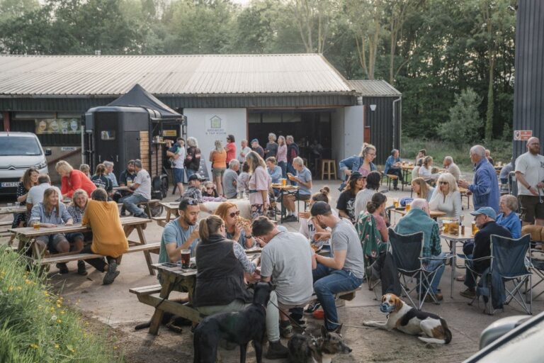 People eating and drinking outside in the sun