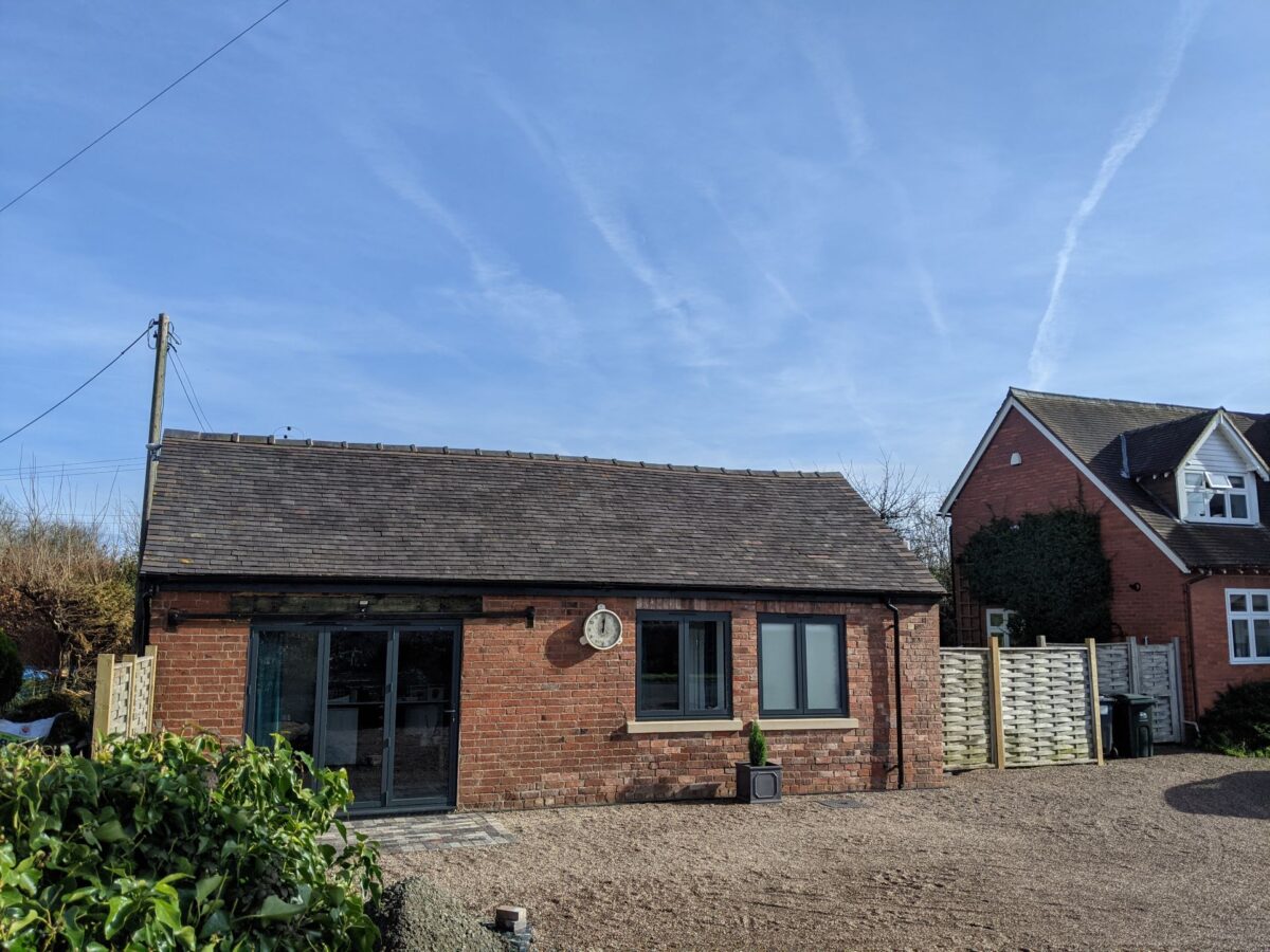 A small converted brick outbuilding