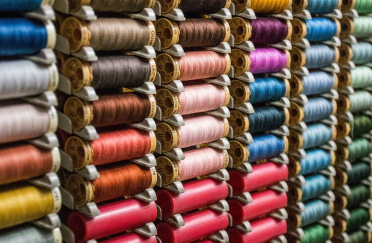 Rows of colourful sewing threads