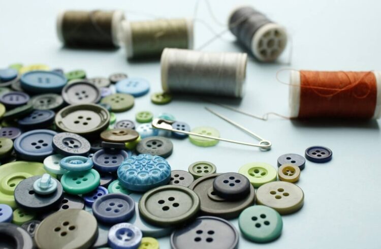 A selection of threads and buttons of various colours