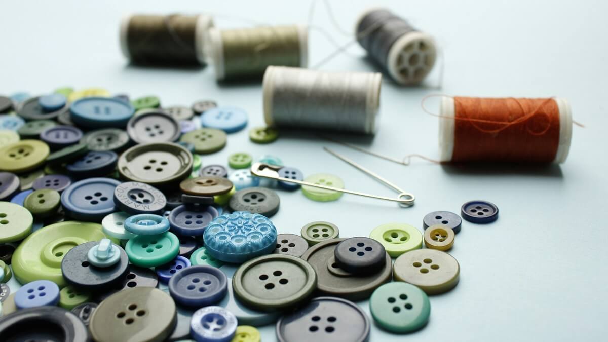 A selection of threads and buttons of various colours