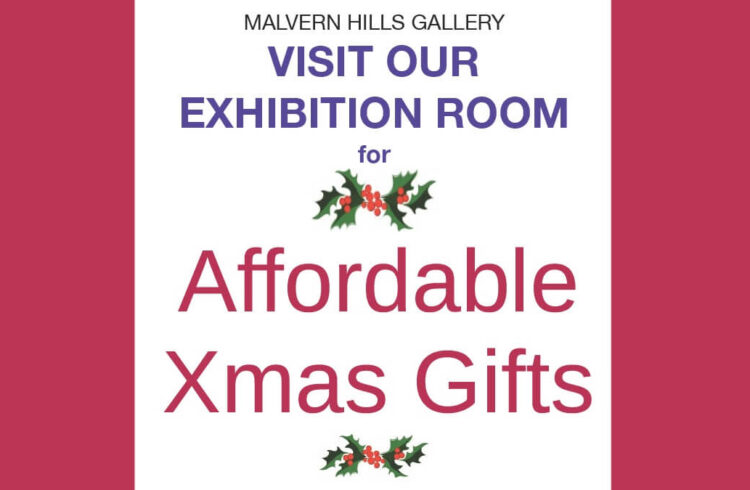 Text reads "Malvern Hills Gallery - visit our exhibition room for affordable Xmas gifts" with two images of holly shown next to text