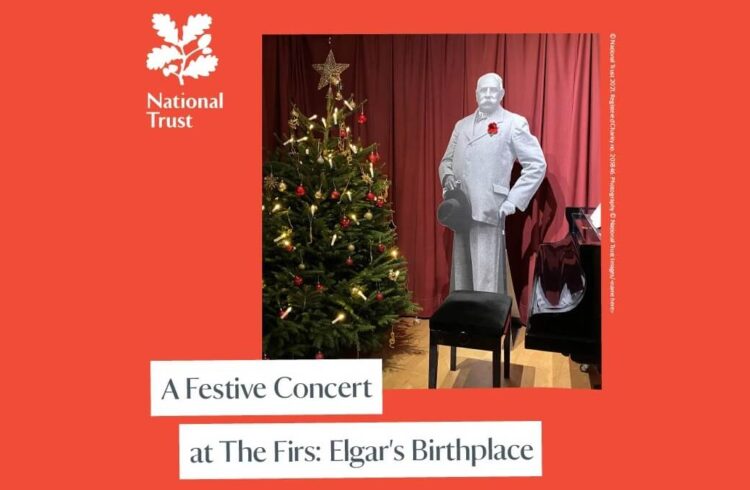 A cut-out figure of Elgar standing next to a piano and Christmas tree